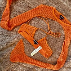 Orange sheer knit bralette and sheer knit sleeves